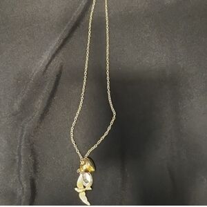 Gold-toned Necklace with a Bird and Heart Charm Along with a Crystal Accent